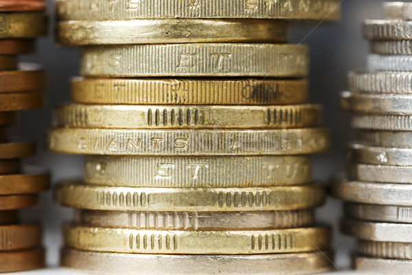 Coins in golden color stacked in a pile Stock photo © marekusz