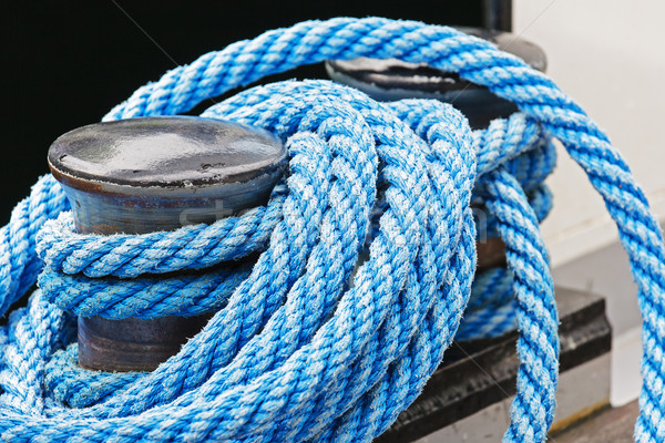 The mooring bollard and blue ropes Stock photo © marekusz