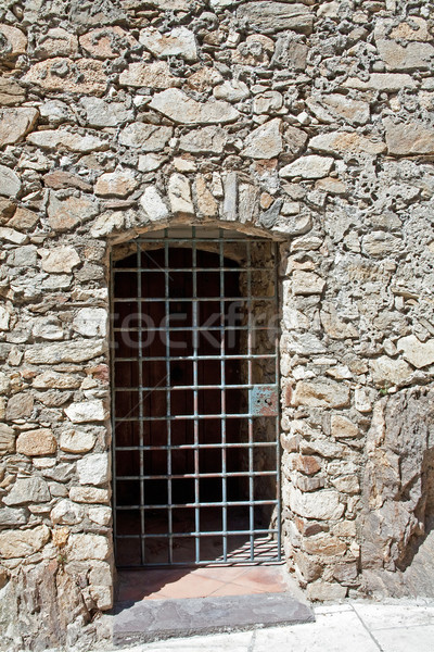 old stone wall and steel bars door Stock photo © marekusz