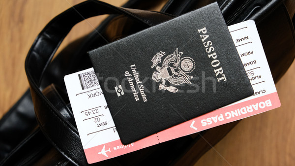 Stock photo: United States passport and boarding pass on bag
