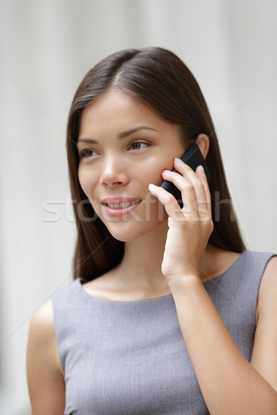 Stock photo: Business woman lawyer talking on smartphone