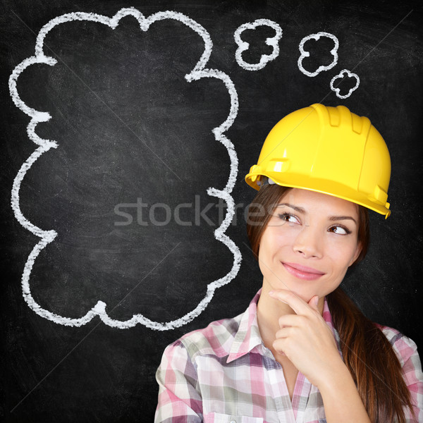Gândire muncitor in constructii fată tabla tineri femeie Imagine de stoc © Maridav