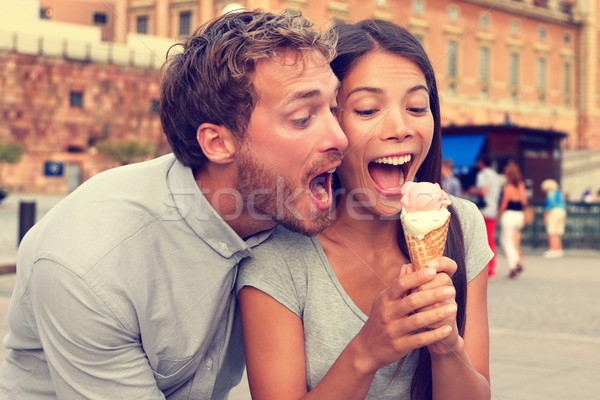 Funny playful young couple eating ice cream Stock photo © Maridav