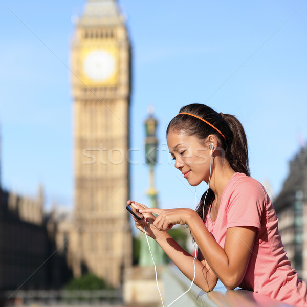 London running girl listening to smartphone music Stock photo © Maridav