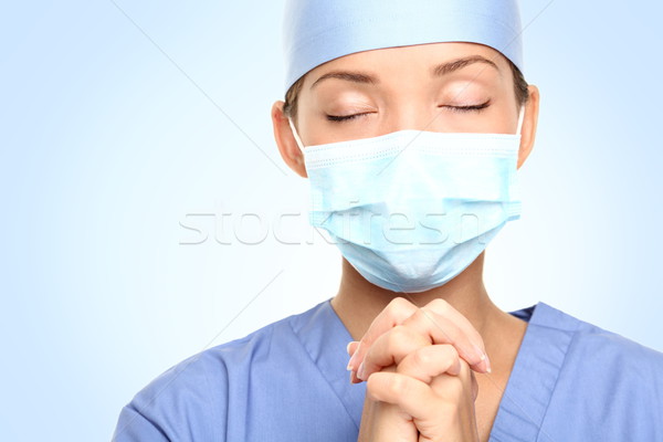 medical doctor praying Stock photo © Maridav