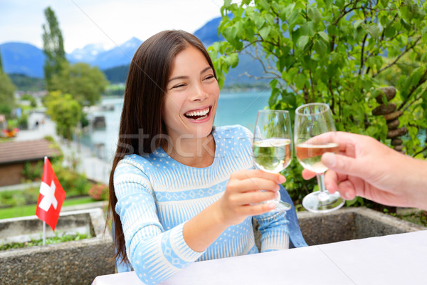 People having fun drinking white wine at dinner Stock photo © Maridav