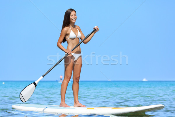 SUP Stand up paddle board woman paddleboarding Stock photo © Maridav