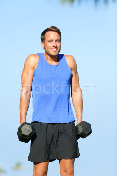 Váll súlyzós edzés fitnessz férfi szabadtér edz Stock fotó © Maridav