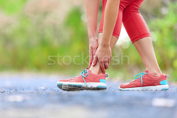 Stock photo: Twisted broken ankle - running sport injury