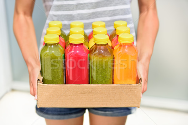 Juicing cold pressed vegetable juices for detox Stock photo © Maridav