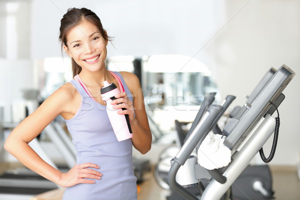 Gymnase femme entraînement eau potable souriant [[stock_photo]] © Maridav