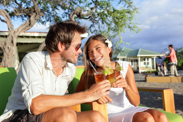 Stock photo: Couple dating having fun drinking alcohol on beach