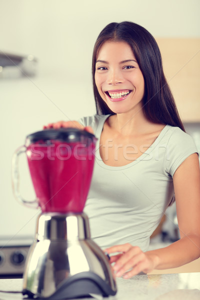 Berry smoothie woman making fruit smoothies Stock photo © Maridav