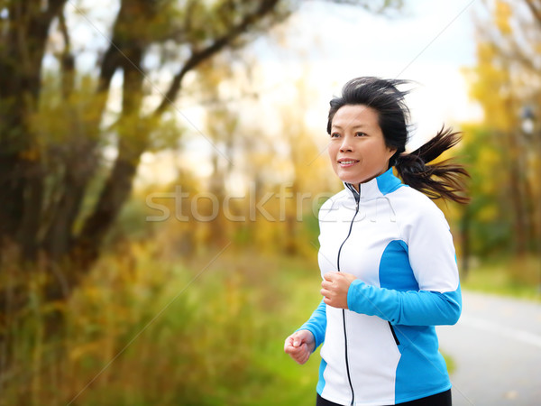 Attivo donna 50s esecuzione jogging di mezza età Foto d'archivio © Maridav