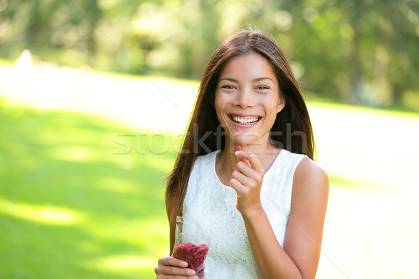 Woman eating goji berries Stock photo © Maridav