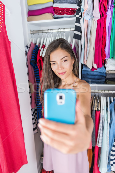 Asian Girl Taking Outfit Selfie In Bedroom Closet Stock