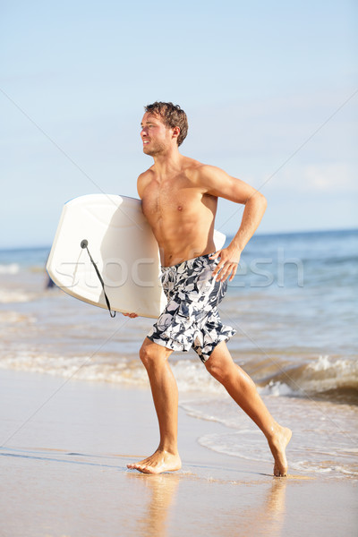 Beach water sports surfing man with body surfboard Stock photo © Maridav