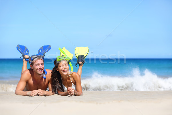 Beach travel couple having fun snorkeling looking Stock photo © Maridav