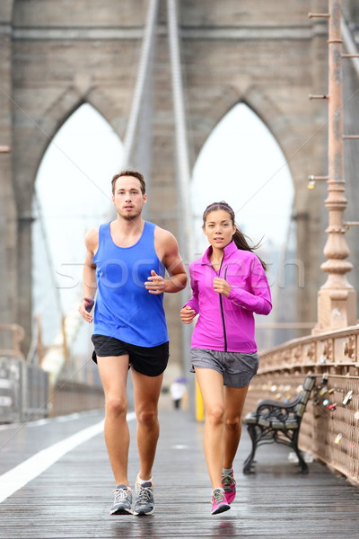 Running couple jogging in New York City Stock photo © Maridav