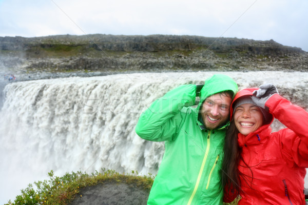 Travel couple fun by Dettifoss waterfall, Iceland Stock photo © Maridav