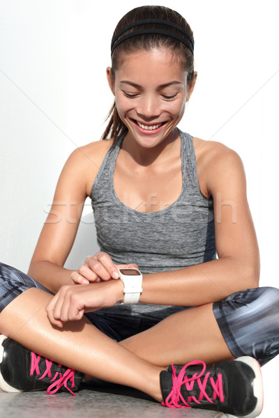 Active runner woman using activity tracker fitness smartwatch Stock photo © Maridav