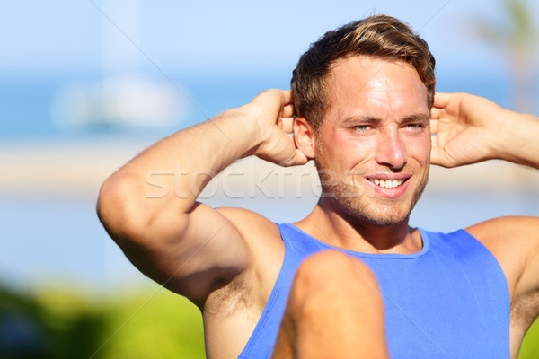 Fitness man doing sit-ups Stock photo © Maridav