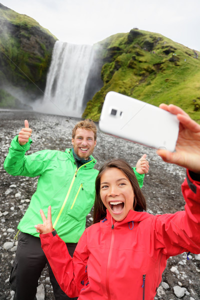 Couple taking selfie smartphone picture waterfall Stock photo © Maridav