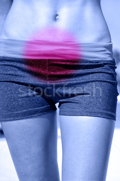 Stomach pain and menstrual cramps in woman abdomen Stock photo © Maridav