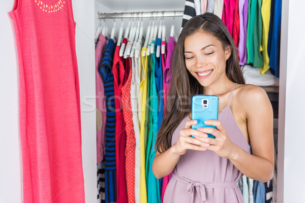 Shopping girl taking mirror selfie in home closet Stock photo © Maridav