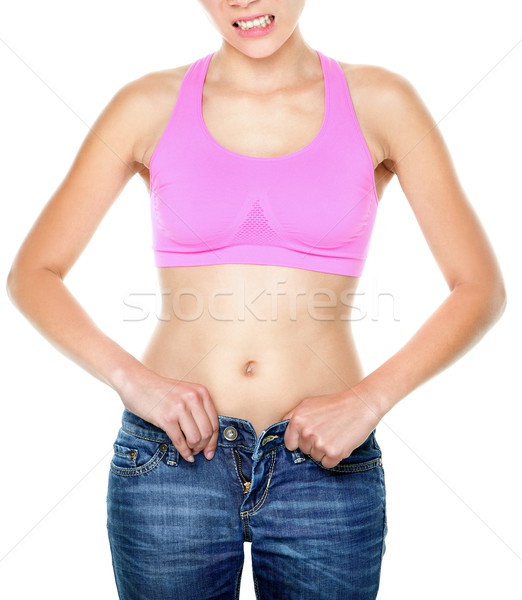 Gewicht vrouw pants moeilijkheden jeans Stockfoto © Maridav