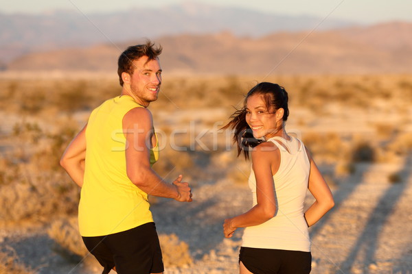 Exercise - couple running looking happy Stock photo © Maridav