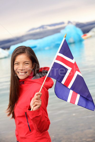 Iceland - girl holding Icelandic flag at glacier Stock photo © Maridav