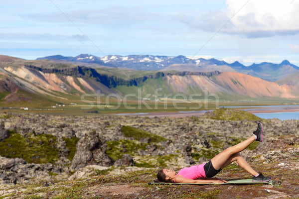 Fitness woman exercising single leg glute bridge Stock photo © Maridav