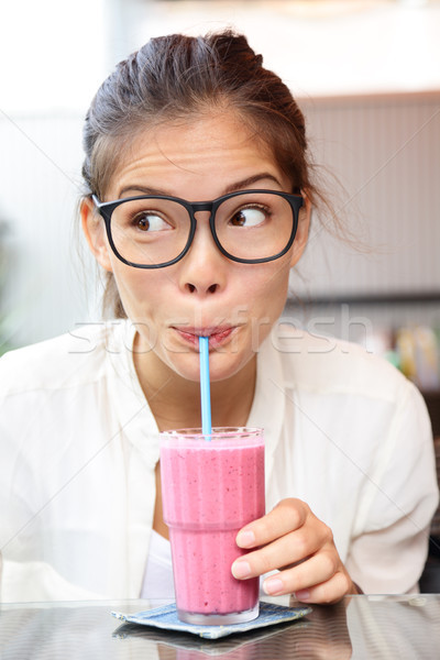 Smoothie - woman hipster with glasses drinking Stock photo © Maridav