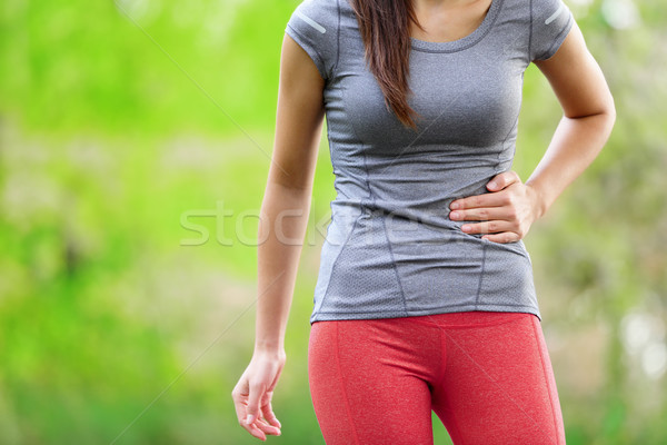 Lateral cusatura femeie alergător funcţionare jogging Imagine de stoc © Maridav