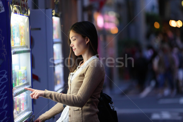 Japan vending machines - Tokyo woman buying drinks Stock photo © Maridav