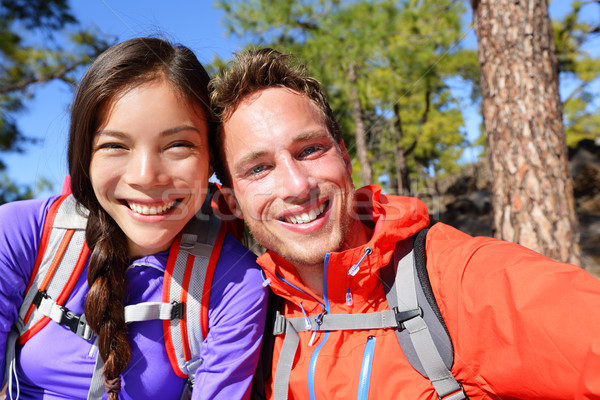 Selfie couple taking self-portrait hiking candid Stock photo © Maridav