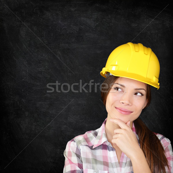 Construction worker woman on chalkboard texture Stock photo © Maridav