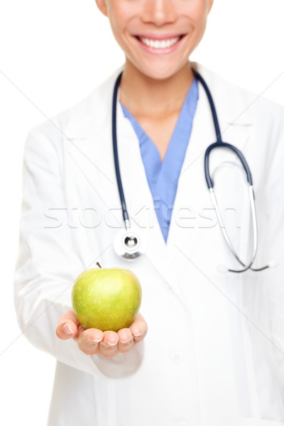 Medical doctor showing apple Stock photo © Maridav