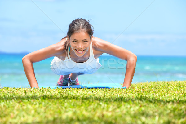 Push-ups fitness woman doing pushups outside Stock photo © Maridav