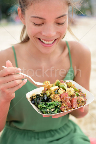 Woman eating local Hawaii food Poke bowl salad Stock photo © Maridav