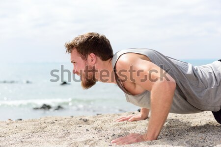 fitness man exercising push ups Stock photo © Maridav