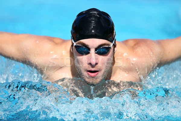 Homme natation papillon concurrence compétitif Photo stock © Maridav