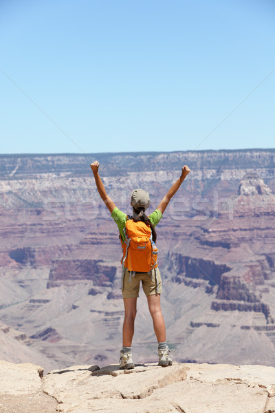 Happy hiker by Grand Canyon south rim cheering Stock photo © Maridav