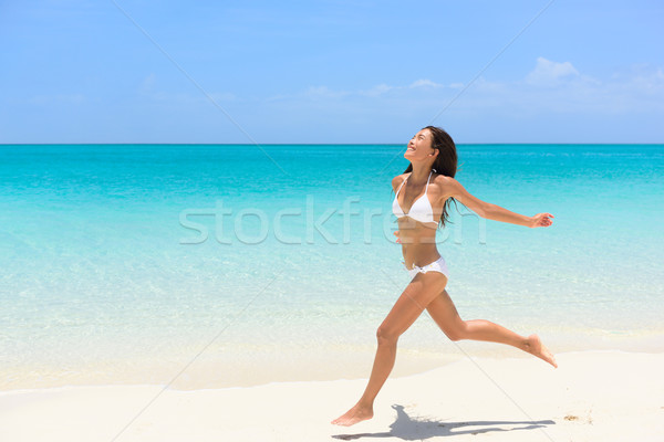 Praia biquíni mulher despreocupado corrida liberdade Foto stock © Maridav