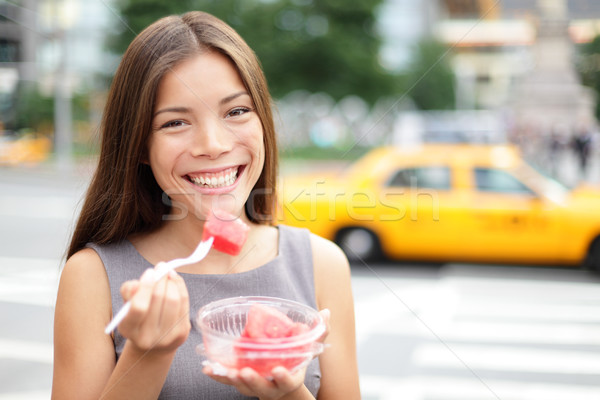 Stock photo: Business woman in New York eating watermelon snack