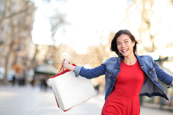 Shopping girl happy shopping outside Stock photo © Maridav