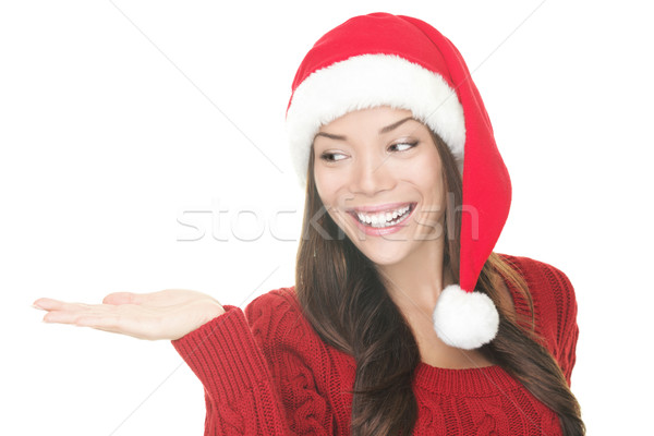 Christmas woman showing your product Stock photo © Maridav
