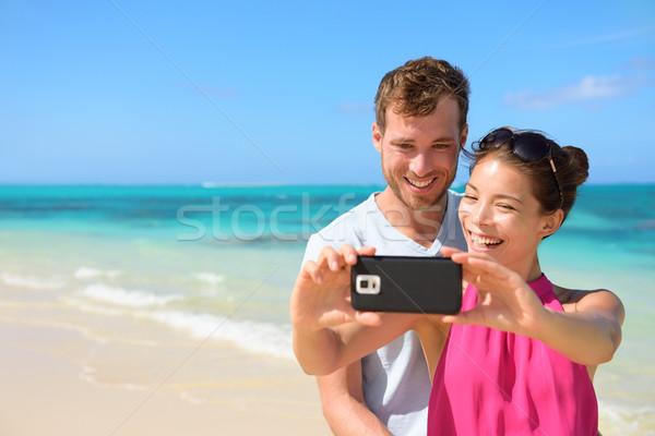 Smartphone - beach vacation couple taking selfie Stock photo © Maridav