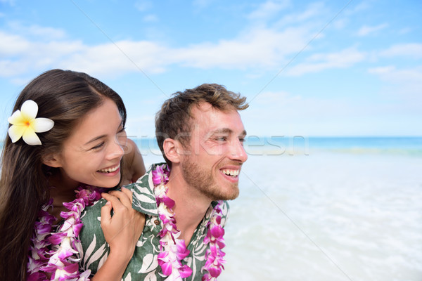 Beach couple having fun piggybacking Hawaii travel Stock photo © Maridav
